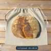 Sac à pain en lin biologique le costaud, présenté avec un gros pain au levain de 2 kg
